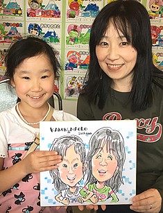 似顔絵をお描きした親子連れ