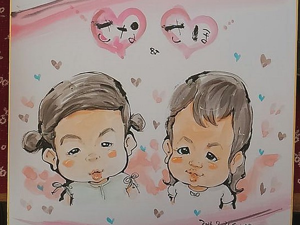 似顔絵師がお描きした姉妹の似顔絵
