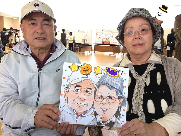 似顔絵を描いてもらったご夫婦