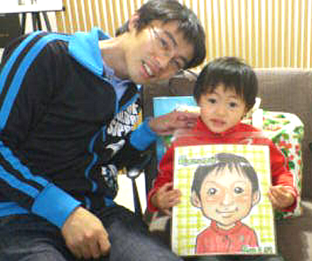 似顔絵をお描きした男の子とそのお父さん