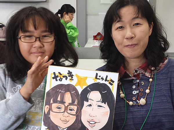 似顔絵をお描きした親子