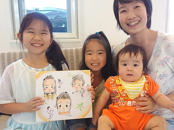 似顔絵をお描きした親子連れ