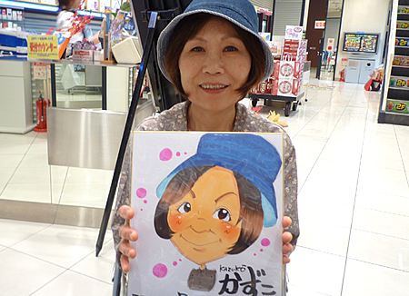 似顔絵をプレゼントした女性