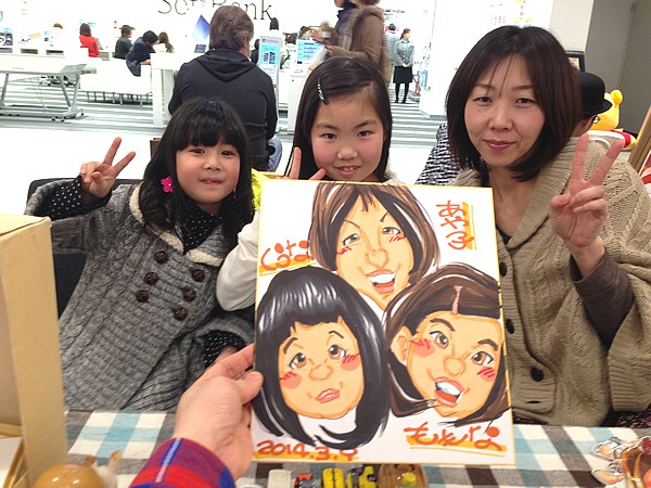 似顔絵をお描きした親子連れ